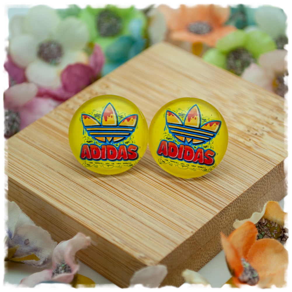 Ohrringe in 20 mm gelb mit ADIDAS und Blüte