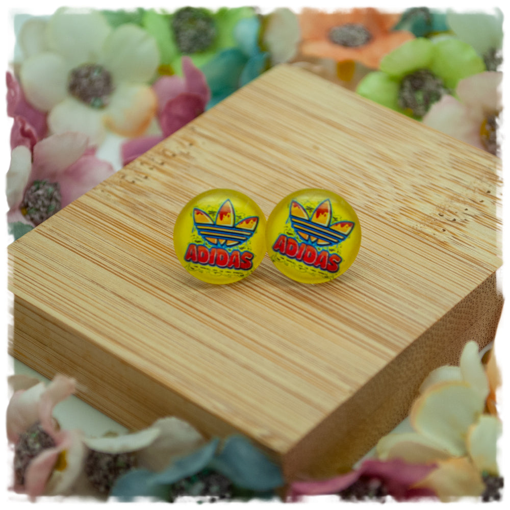 Ohrringe in 14 mm gelb mit adidas Blüte