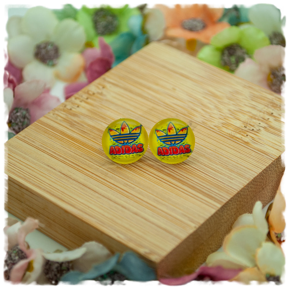 Ohrringe in 12 mm gelb mit adidas Blüte