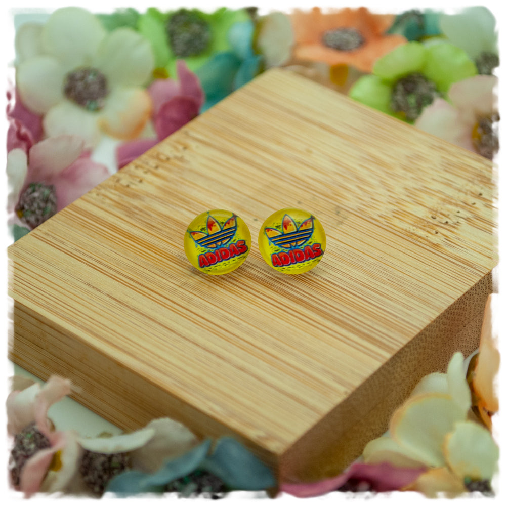 Ohrringe in 10 mm gelb mit adidas Blüte